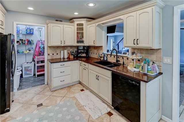 5300 NW 58th Ter, Kansas City, MO 64151 - kitchen featuring black appliances, glass insert cabinets, decorative backsplash, and recessed lighting
