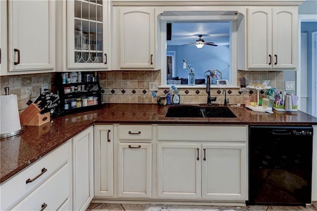 5300 NW 58th Ter, Kansas City, MO 64151 - kitchen featuring black dishwasher, a ceiling fan, tasteful backsplash, and glass insert cabinets