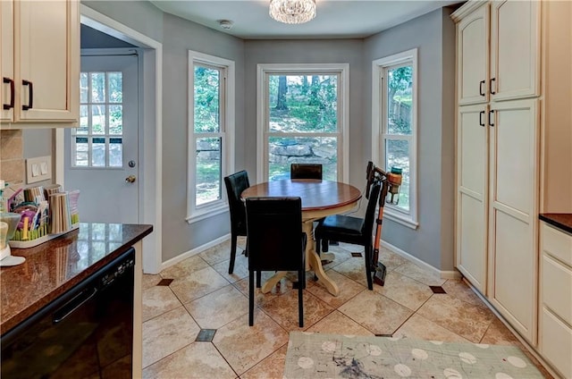 5300 NW 58th Ter, Kansas City, MO 64151 - dining space featuring plenty of natural light, light tile patterned flooring, and a chandelier