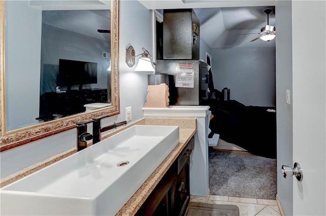 5300 NW 58th Ter, Kansas City, MO 64151 - bathroom with vanity, a ceiling fan, and tile patterned floors