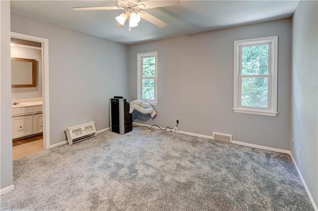 5300 NW 58th Ter, Kansas City, MO 64151 - carpeted empty room with a ceiling fan and baseboards