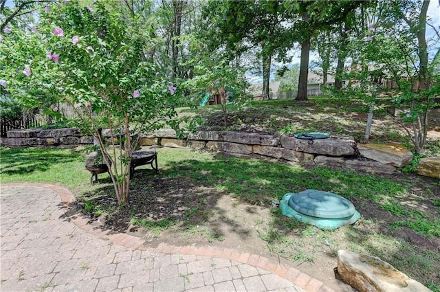5300 NW 58th Ter, Kansas City, MO 64151 - view of yard featuring a fire pit