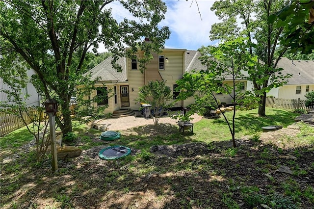 5300 NW 58th Ter, Kansas City, MO 64151 - rear view of property with a shingled roof and entry steps