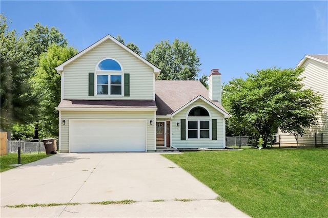 704 Canter St, Raymore, MO 64083 - view of front of home with an attached garage and driveway