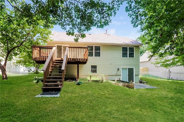 704 Canter St, Raymore, MO 64083 - back of property featuring stairs and a wooden deck