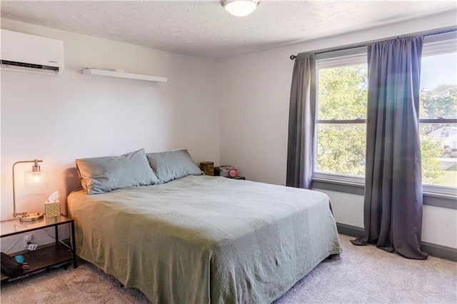 2026 E 70th Ter, Kansas City, MO 64132 - bedroom with an AC wall unit and light colored carpet