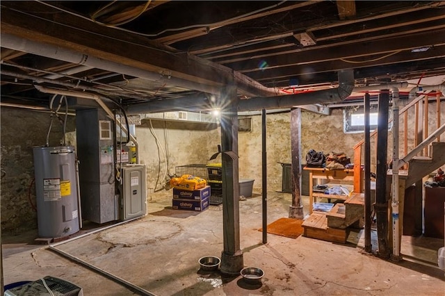 2026 E 70th Ter, Kansas City, MO 64132 - basement with electric water heater, heating unit, and stairs