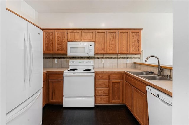 613 S Woodson Ln, Gardner, KS 66030 - kitchen featuring white appliances, decorative backsplash, brown cabinetry, and light countertops