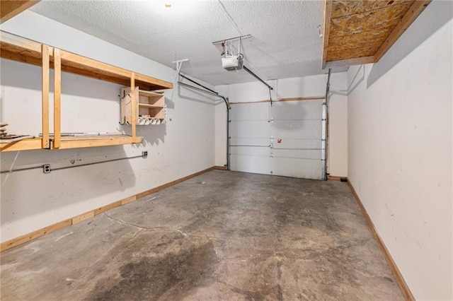 613 S Woodson Ln, Gardner, KS 66030 - garage featuring a garage door opener and baseboards