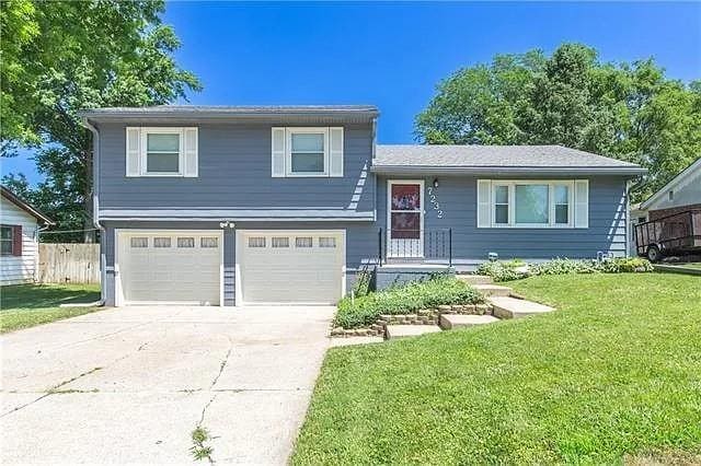 7232 Berger Ave, Kansas City, KS 66111 - split level home featuring an attached garage and concrete driveway
