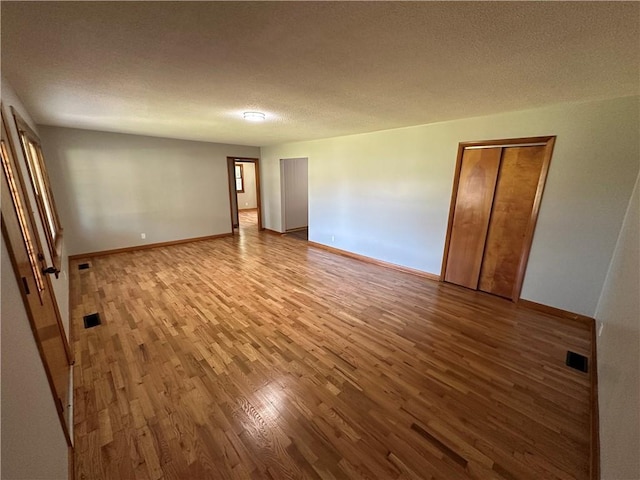 533 Utah St, Leavenworth, KS 66048 - unfurnished room with wood finished floors and a textured ceiling