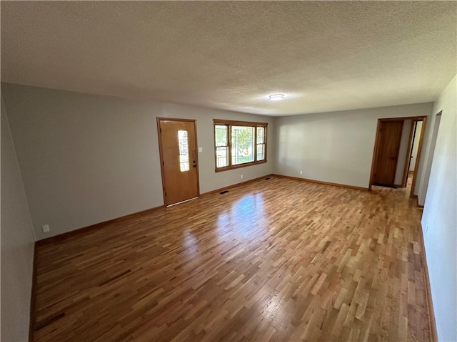 533 Utah St, Leavenworth, KS 66048 - unfurnished room with wood finished floors and a textured ceiling
