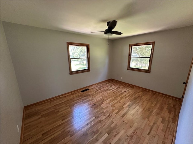 533 Utah St, Leavenworth, KS 66048 - spare room featuring plenty of natural light, wood finished floors, and a ceiling fan