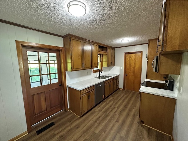 533 Utah St, Leavenworth, KS 66048 - kitchen with appliances with stainless steel finishes, dark wood-style flooring, ornamental molding, a textured ceiling, and light countertops