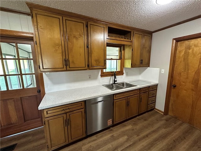 533 Utah St, Leavenworth, KS 66048 - kitchen featuring stainless steel dishwasher, ornamental molding, dark wood-type flooring, a textured ceiling, and light countertops