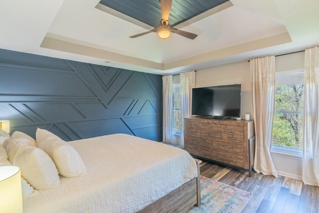 4603 N 111th St, Kansas City, KS 66109 - bedroom with a tray ceiling, wood finished floors, and a ceiling fan