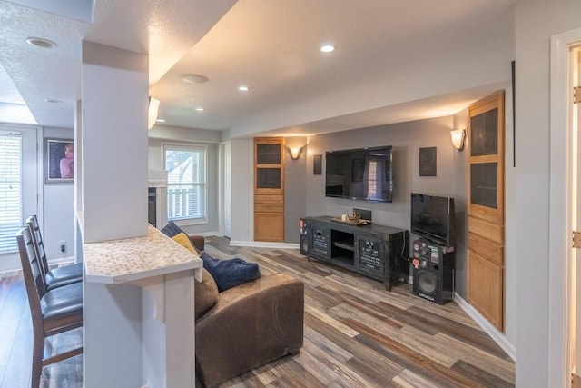 4603 N 111th St, Kansas City, KS 66109 - living area with wood finished floors, recessed lighting, and a fireplace
