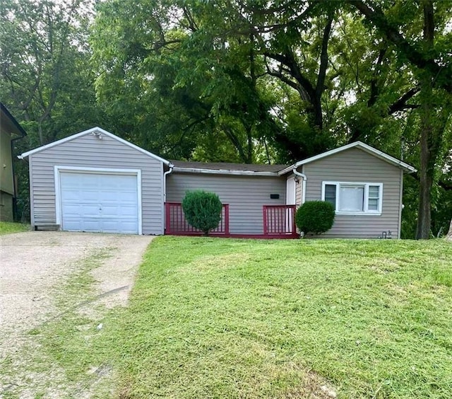 4216 Cypress Ave, Kansas City, MO 64130 - ranch-style home with driveway, a front lawn, and a garage