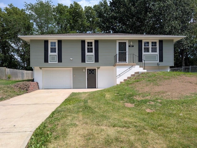 2205 S Owing St, Oak Grove, MO 64075 - view of front facade with a garage and concrete driveway