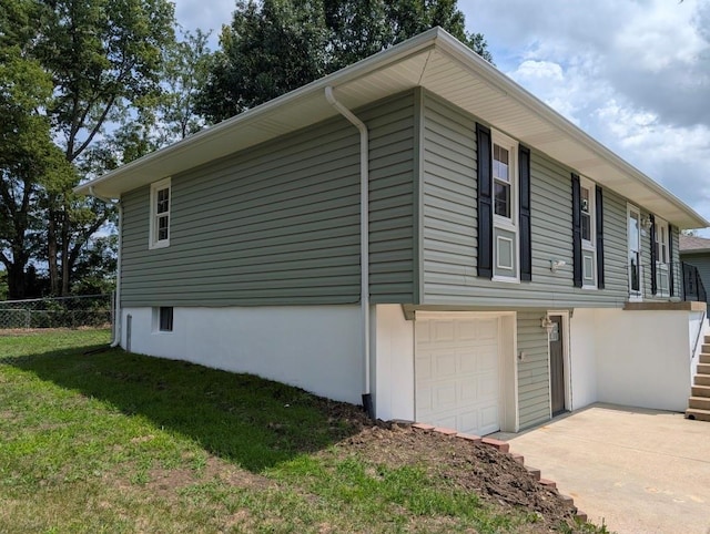 2205 S Owing St, Oak Grove, MO 64075 - view of property exterior featuring a garage and driveway