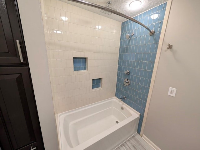 2205 S Owing St, Oak Grove, MO 64075 - bathroom with a textured ceiling and a combined bath / shower with rainfall shower