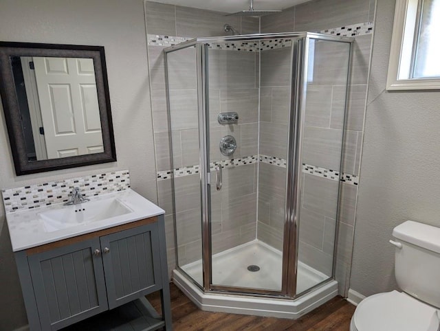2205 S Owing St, Oak Grove, MO 64075 - bathroom with a stall shower, vanity, wood finished floors, and a textured wall