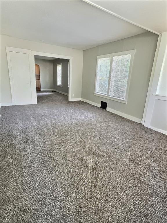 8409 Park Ave, Kansas City, MO 64132 - empty room with carpet floors