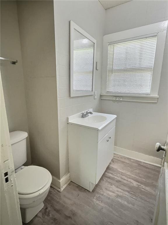 8409 Park Ave, Kansas City, MO 64132 - bathroom featuring wood finished floors and vanity