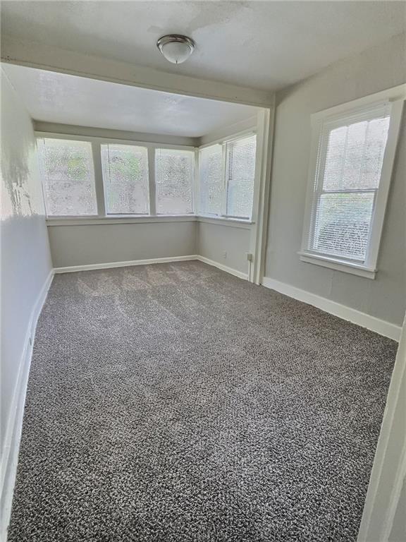 8409 Park Ave, Kansas City, MO 64132 - empty room featuring plenty of natural light