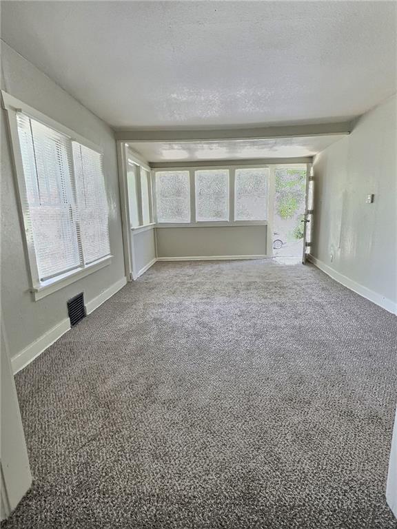 8409 Park Ave, Kansas City, MO 64132 - view of unfurnished sunroom
