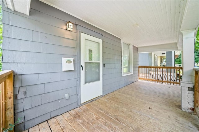 3543 Flora Ave, Kansas City, MO 64109 - view of wooden porch