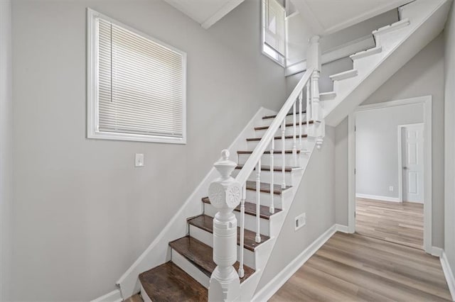 3543 Flora Ave, Kansas City, MO 64109 - stairway with wood finished floors and baseboards