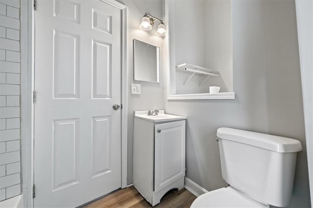 3543 Flora Ave, Kansas City, MO 64109 - bathroom with vanity and wood finished floors