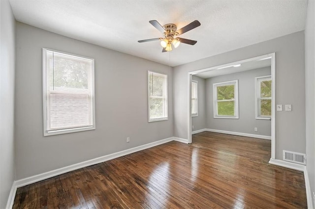 3543 Flora Ave, Kansas City, MO 64109 - unfurnished room with wood-type flooring and ceiling fan