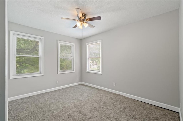 3543 Flora Ave, Kansas City, MO 64109 - unfurnished room featuring ceiling fan, carpet floors, and a textured ceiling