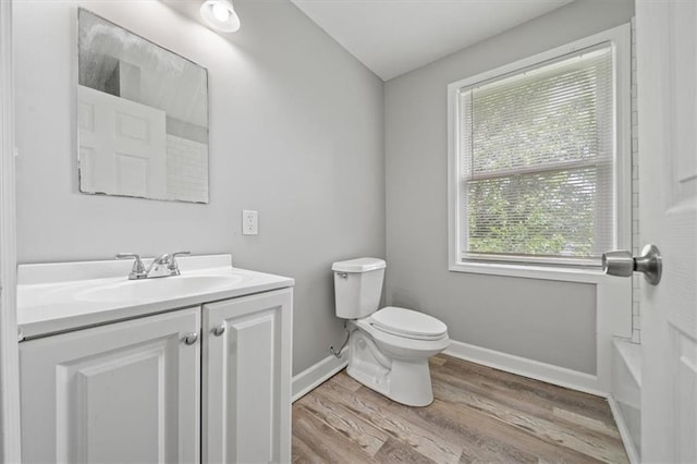 3543 Flora Ave, Kansas City, MO 64109 - full bath with vanity and wood finished floors