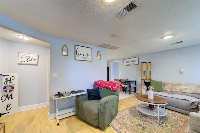 3136 S 8th St, Kansas City, KS 66103 - living room featuring wood finished floors and a textured ceiling