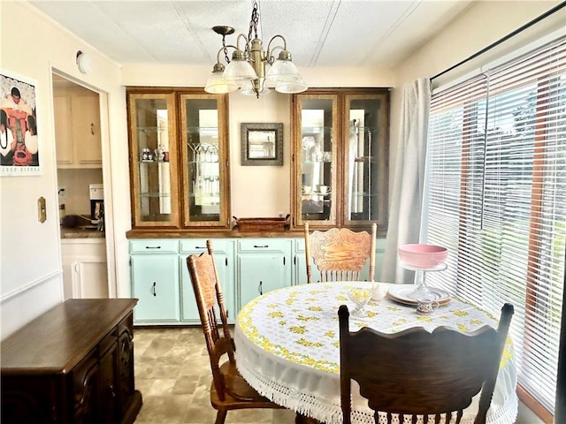 14444 E Quail Rd, Nevada, MO 64772 - dining space featuring a chandelier