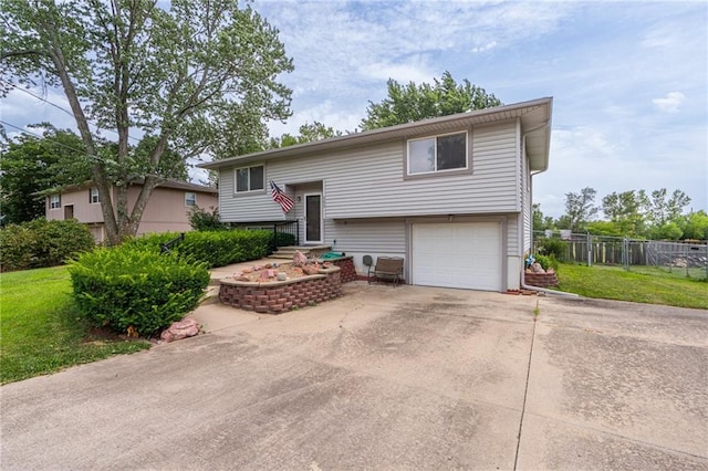 303 W S St, Spring Hill, KS 66083 - split foyer home with an attached garage and driveway