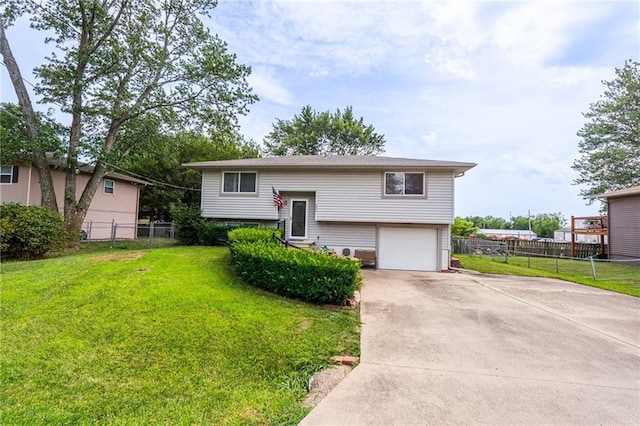 303 W S St, Spring Hill, KS 66083 - raised ranch featuring a garage and driveway