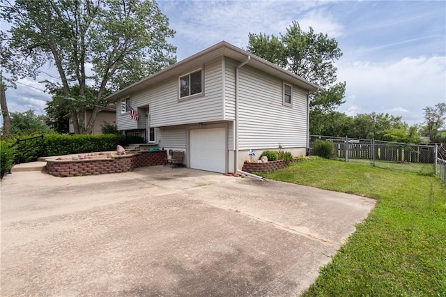 303 W S St, Spring Hill, KS 66083 - view of side of property with an attached garage and concrete driveway