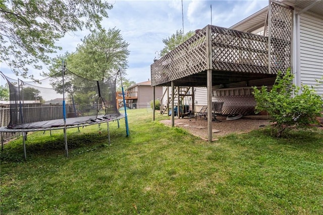 303 W S St, Spring Hill, KS 66083 - view of yard with a trampoline, a wooden deck, and stairway