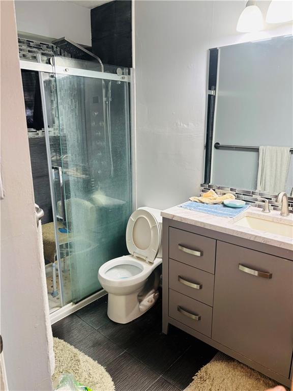 2506 S 48th Ter, Kansas City, KS 66106 - bathroom with vanity and a stall shower
