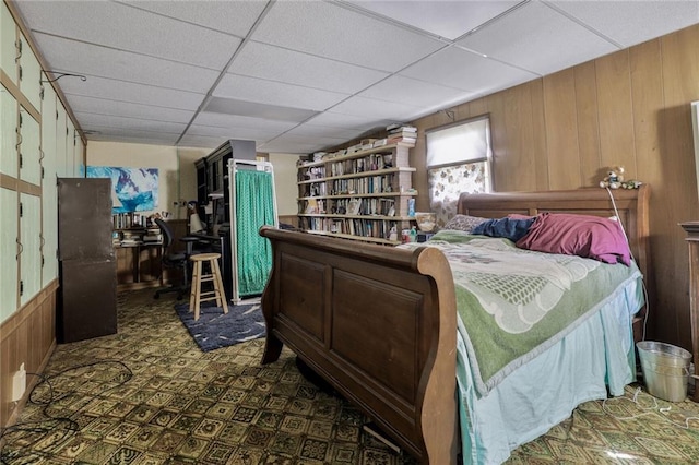 502 N Tennessee St, Iola, KS 66749 - bedroom featuring wood walls and a paneled ceiling