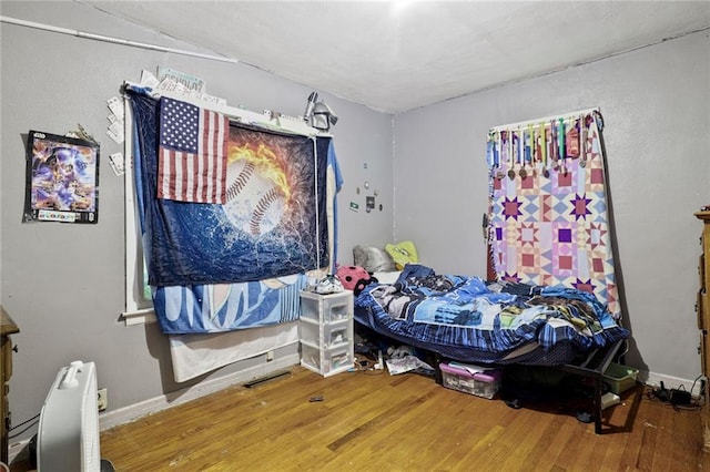 502 N Tennessee St, Iola, KS 66749 - bedroom with wood finished floors and baseboards