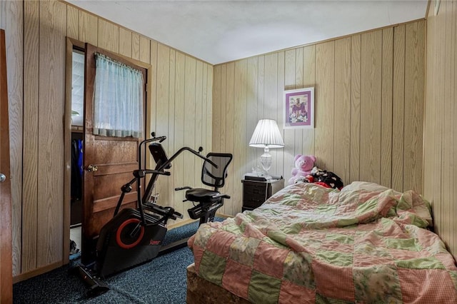 502 N Tennessee St, Iola, KS 66749 - carpeted bedroom featuring wooden walls