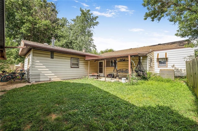 502 N Tennessee St, Iola, KS 66749 - rear view of house with a patio area