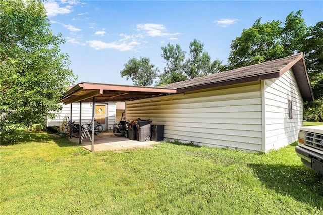 502 N Tennessee St, Iola, KS 66749 - back of house featuring a yard and a patio area