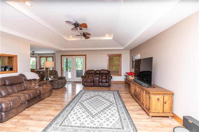 29309 E State Route B, Archie, MO 64725 - living room featuring ceiling fan, light wood-type flooring, a raised ceiling, and recessed lighting