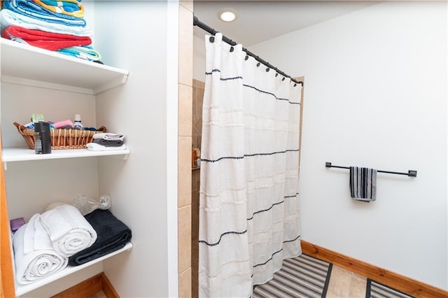 29309 E State Route B, Archie, MO 64725 - full bathroom with baseboards and curtained shower